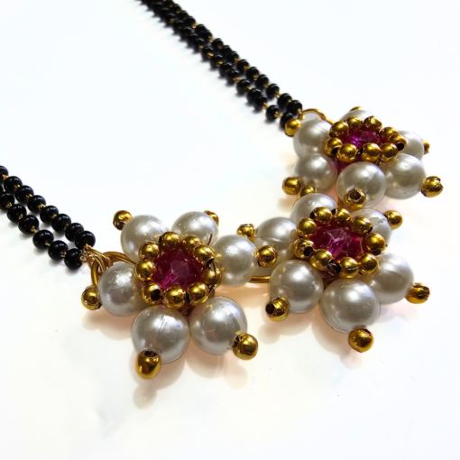 Moti Kudi short mangalsutra with white pearls and three-flower pendant, matching earrings included