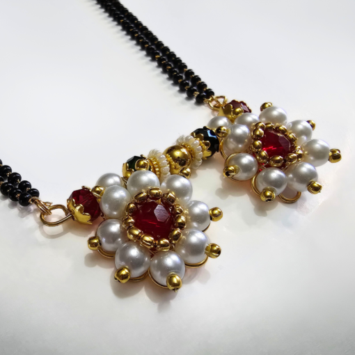 Moti Kudi long mangalsutra with white pearl design and matching earrings